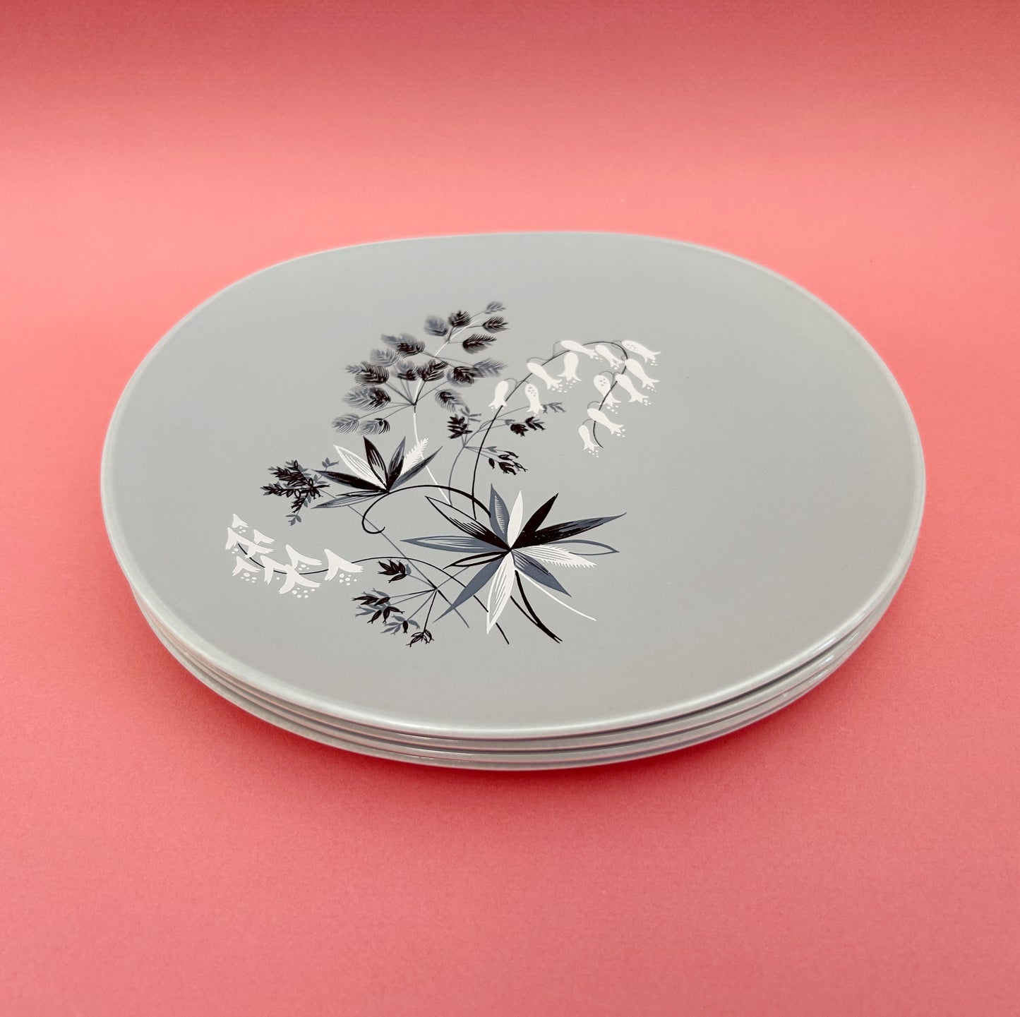 Set of four grey side plates