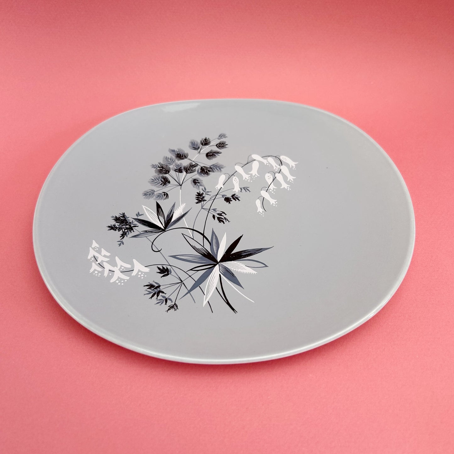 Set of four grey side plates